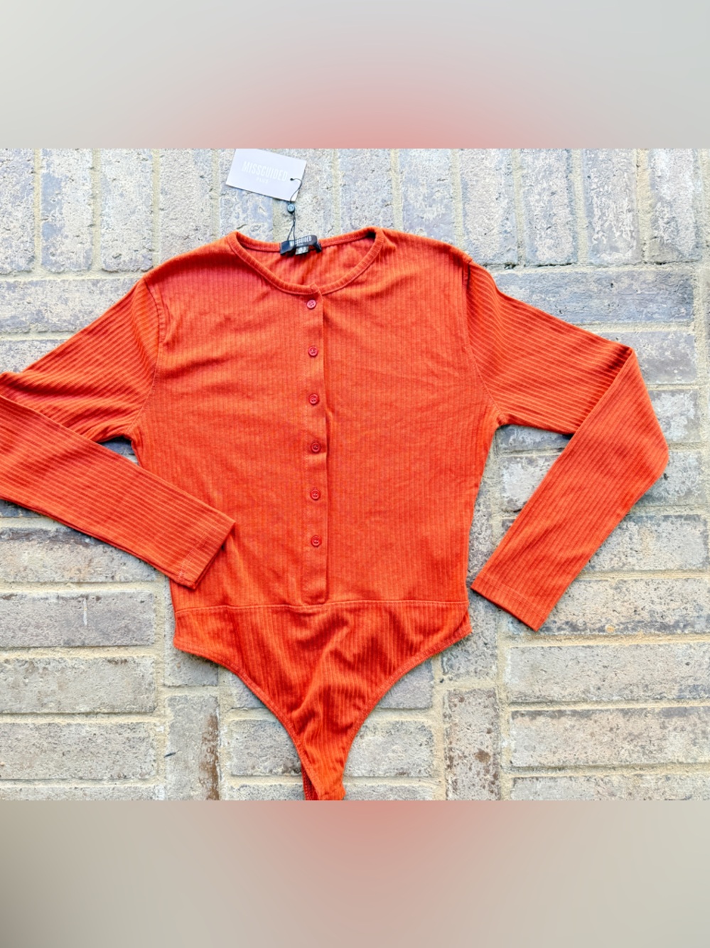 Missguided + Orange Ribbed Button Front Long Sleeve Bodysuit